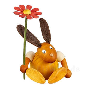 Hase mit Blume sitzend gelb klein