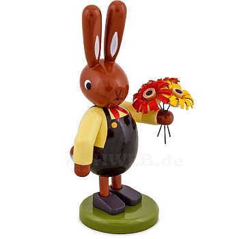 Easter bunny with bouquet of flowers and brown pants