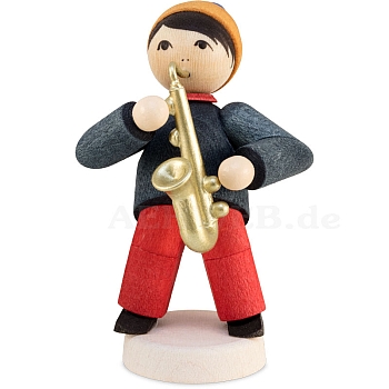 Winter musician boy with saxophone stained