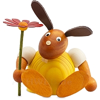 Easter Bunny with flower seated, yellow largely