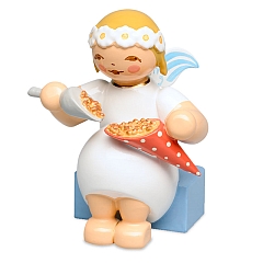 Marguerite Angel sitting with Roasted Almonds from Wendt & Kühn